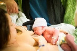 Image of woman breastfeeding a newborn baby tips to make breastfeeding easier